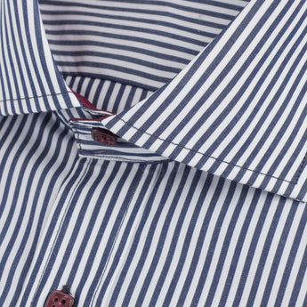 close up of navy striped dress shirt with spread collar and interior burgundy color detail